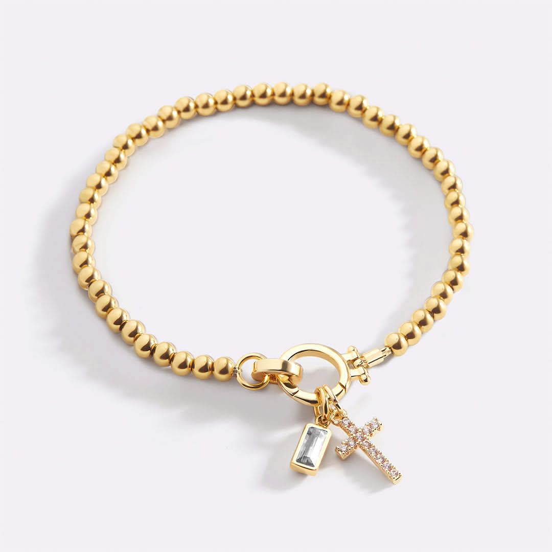 Bracelet avec pierre de naissance et breloque en croix