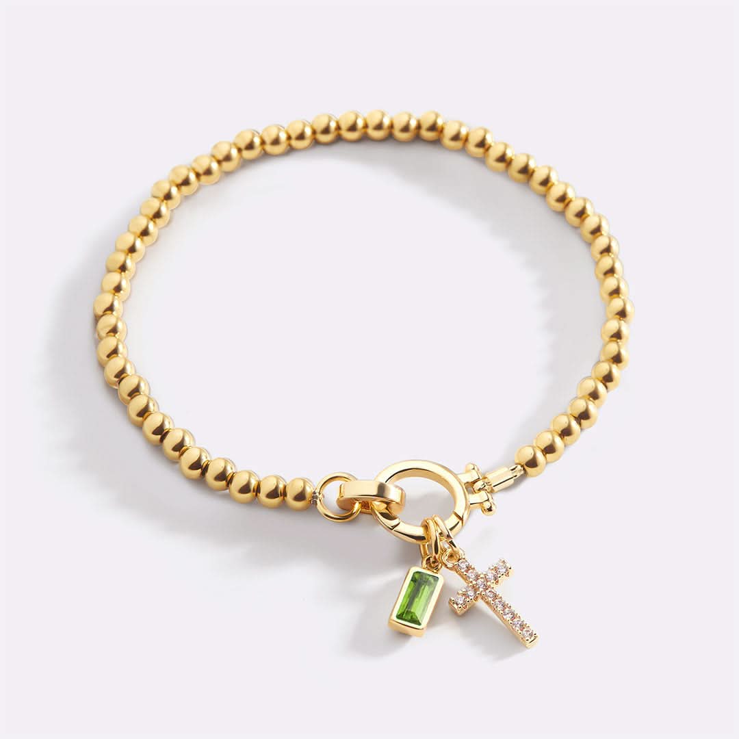 Bracelet avec pierre de naissance et breloque en croix