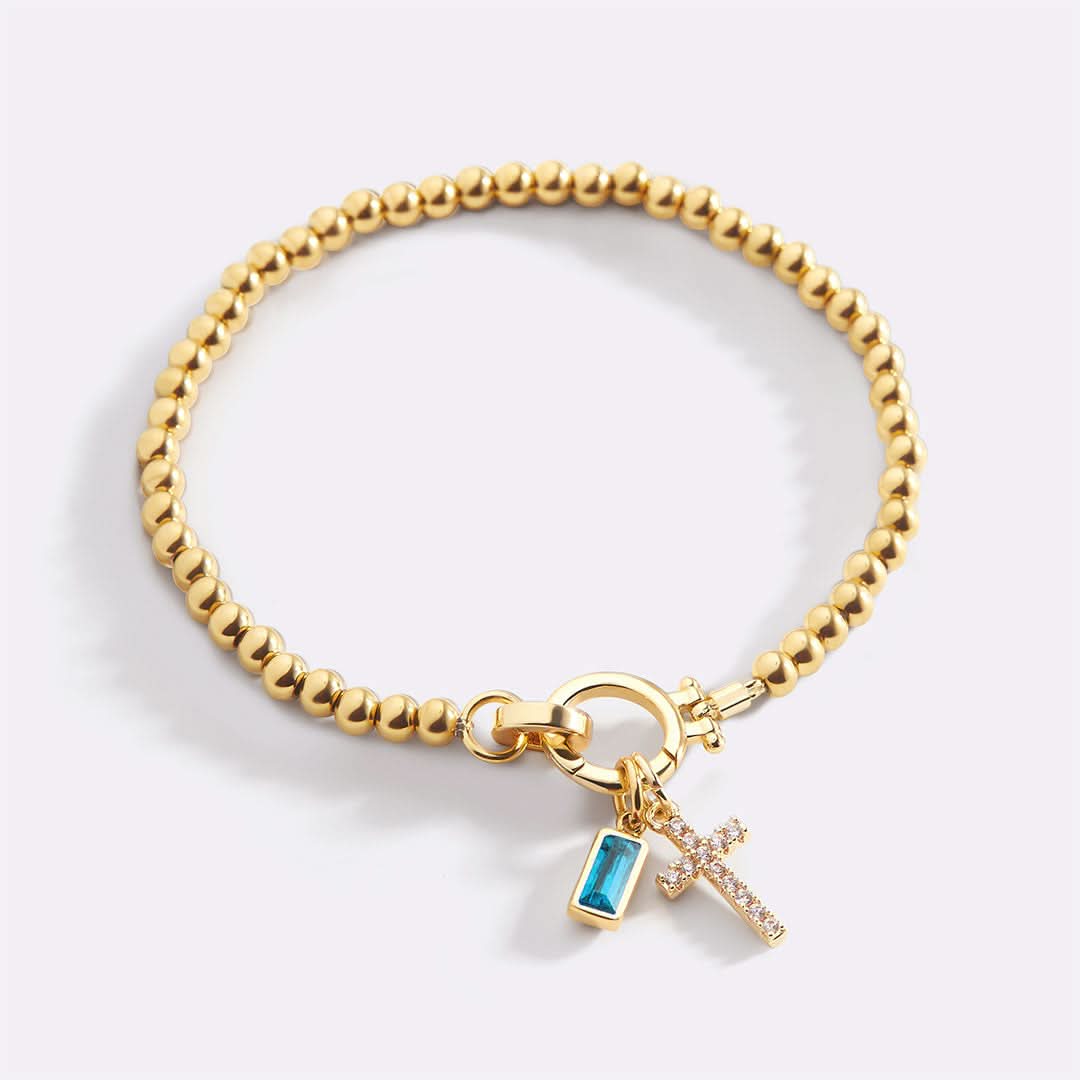 Bracelet avec pierre de naissance et breloque en croix