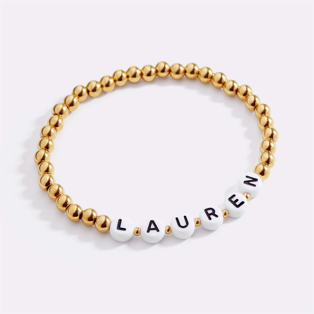 Pulsera personalizada con nombre y cuentas de oro