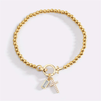 Bracelet avec pierre de naissance et breloque en croix