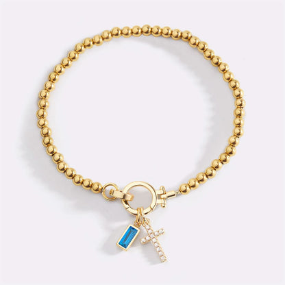 Bracelet avec pierre de naissance et breloque en croix