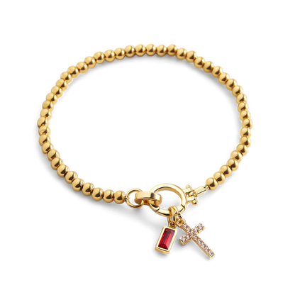 Bracelet avec pierre de naissance et breloque en croix