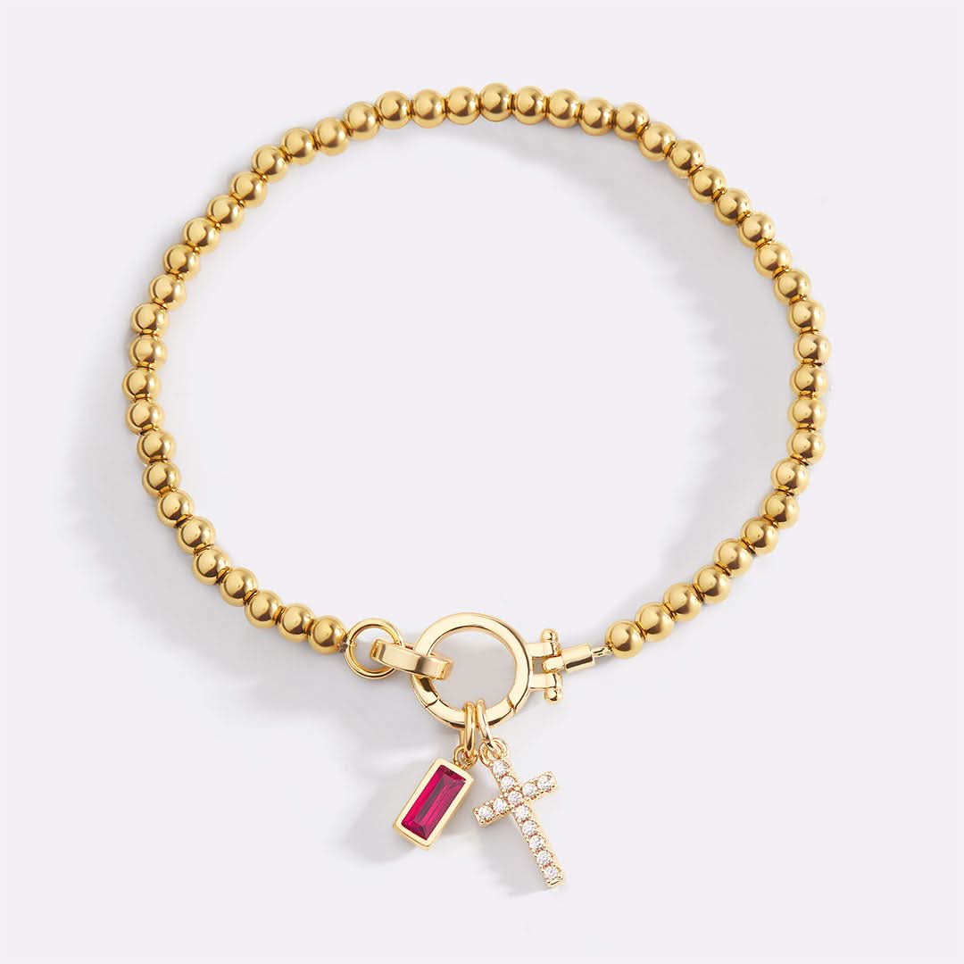 Bracelet avec pierre de naissance et breloque en croix