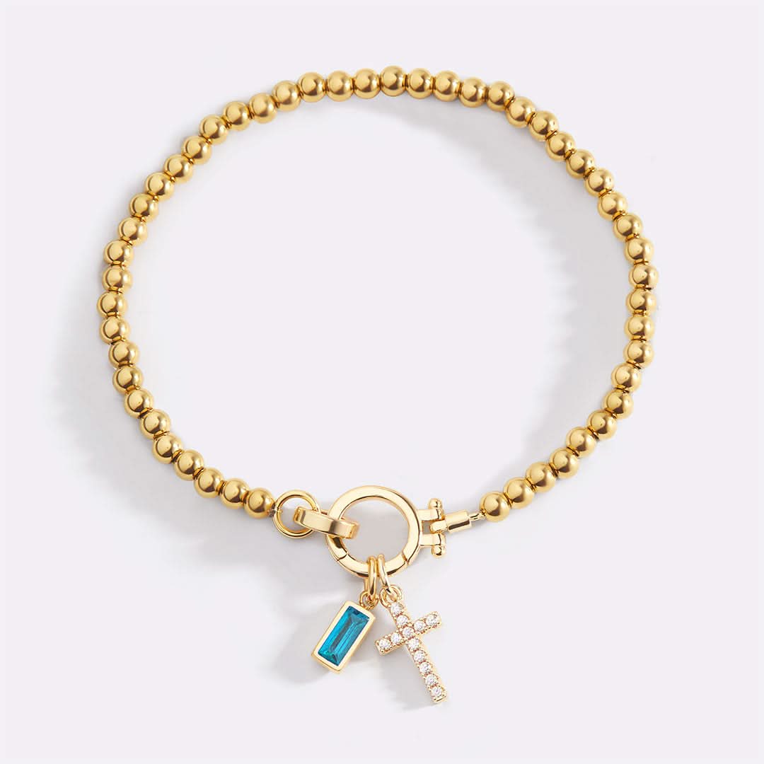 Bracelet avec pierre de naissance et breloque en croix