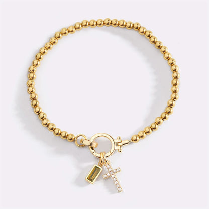 Bracelet avec pierre de naissance et breloque en croix
