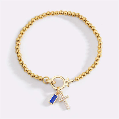 Bracelet avec pierre de naissance et breloque en croix