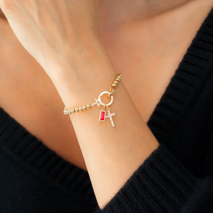 Bracelet avec pierre de naissance et breloque en croix