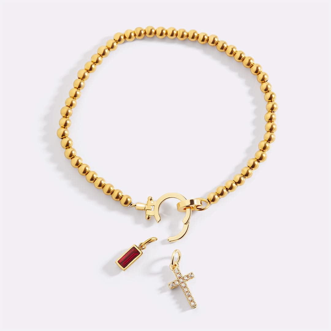 Bracelet avec pierre de naissance et breloque en croix