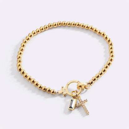 Bracelet avec pierre de naissance et breloque en croix