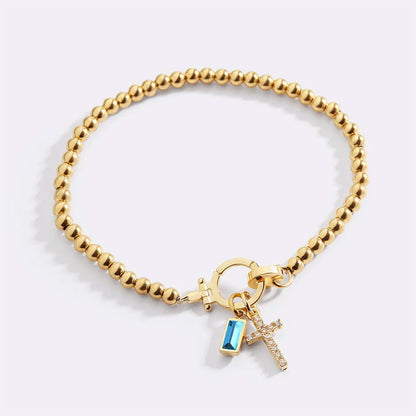 Bracelet avec pierre de naissance et breloque en croix