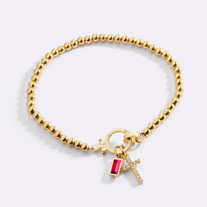 Bracelet avec pierre de naissance et breloque en croix